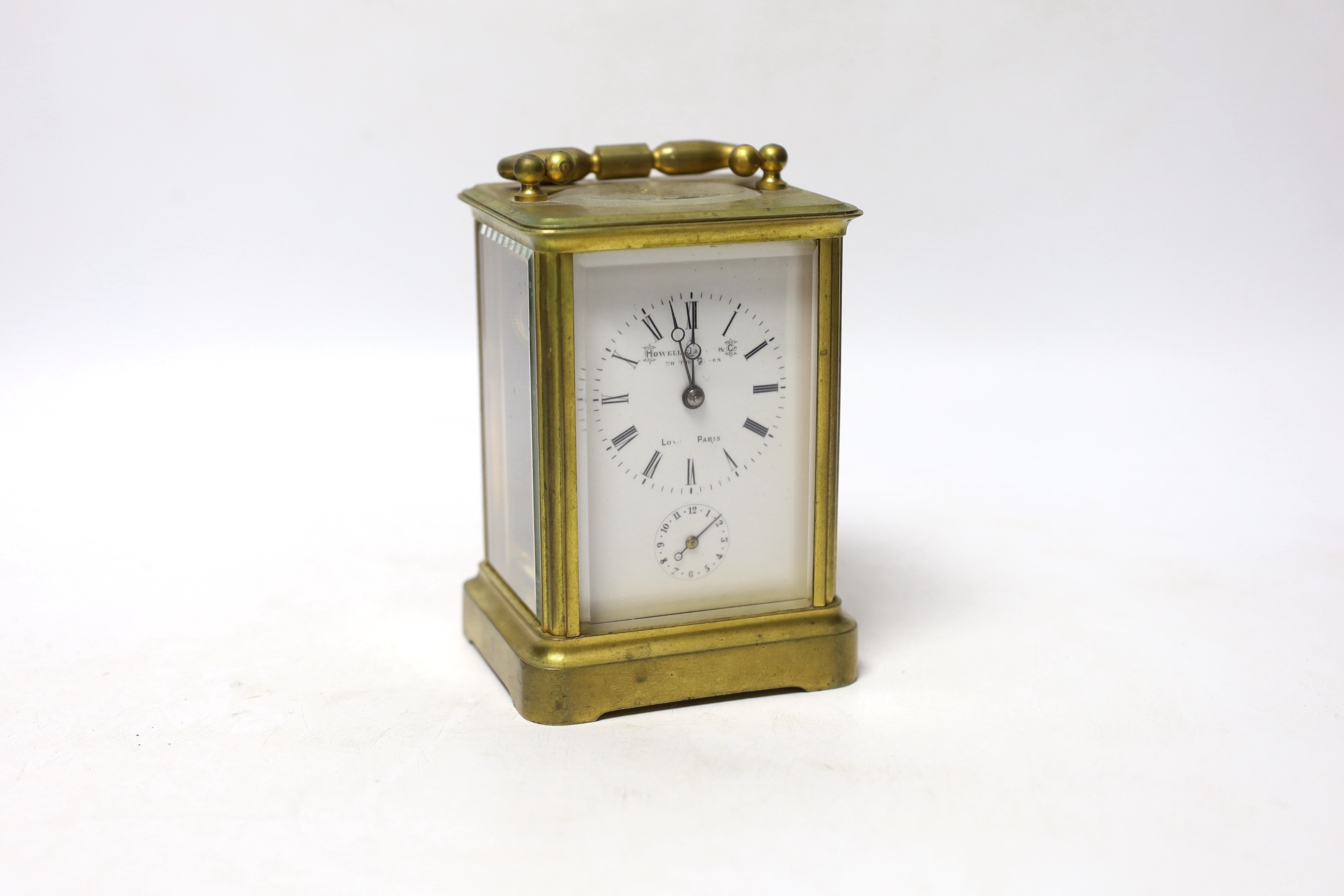 A French brass carriage clock striking on a bell, 12cm